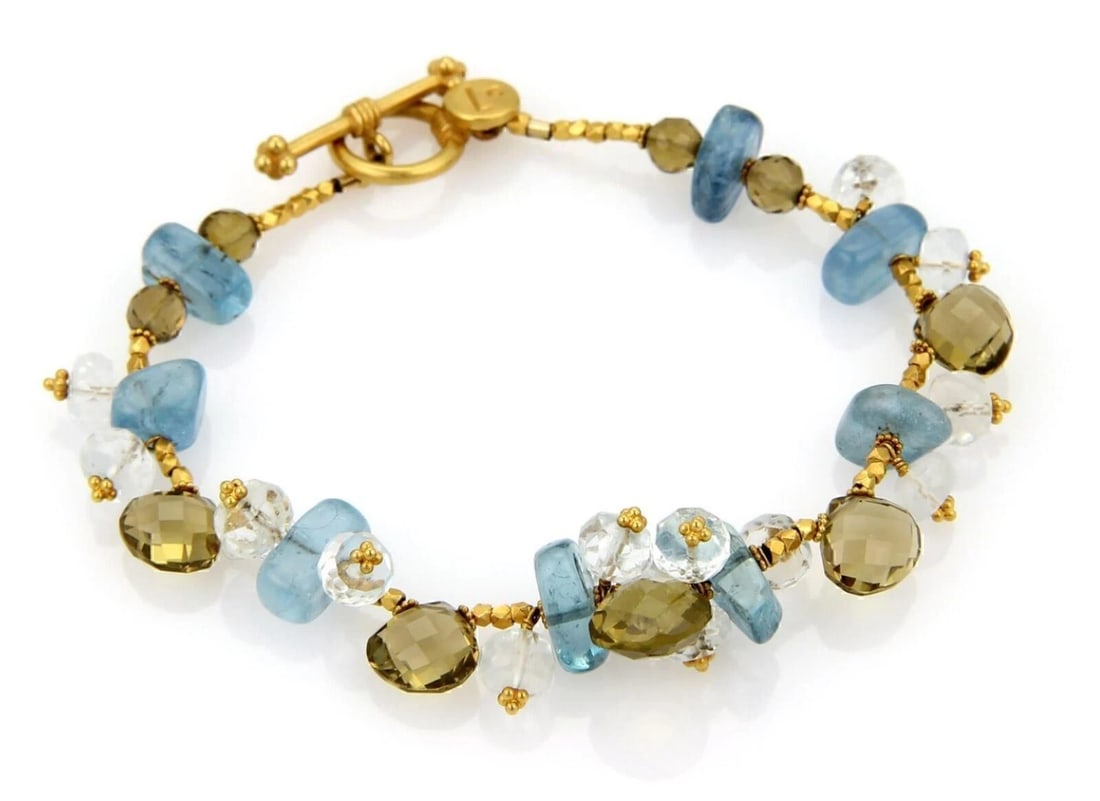 LAURA GIBSON 22K GOLD & MULTICOLOR BEADED CLUSTER GEMSTONE TOGGLE BRACELET: Laura Gibson 22k Gold & MultiColor Beaded Cluster Gemstone Toggle Bracelet Brand: Laura Gibson Type: Bracelet Material: 22k yellow gold Color: Multi-Color Size: Measurements: 7.5" long and 13mm wi
