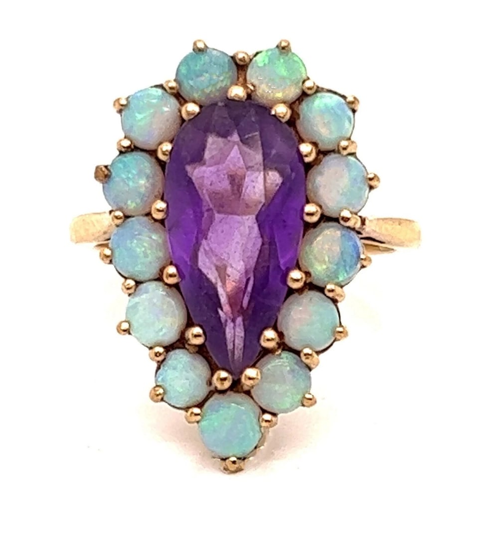 AMETHYST & OPAL PEAR SHAPE EUROPEAN RING: Amethyst & Opal Pear Shape European Ring Brand: Unbranded Type: Ring Material: 9k yellow gold Main Stone/Creation/Gemstone Gemstone: Amethyst Color: None Size: 5.5 US Accessories: None