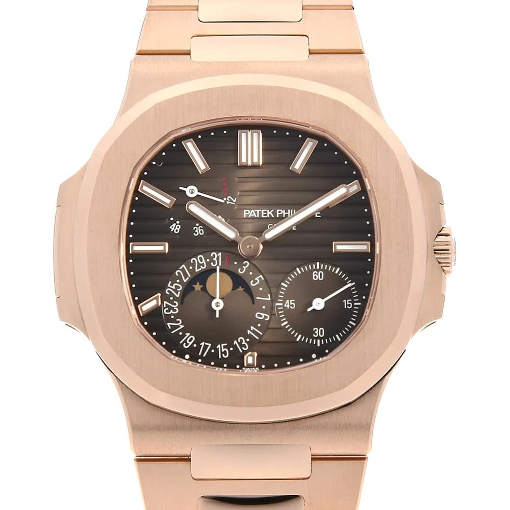 PATEK PHILIPPE NAUTILUS MOONPHASE SECOND HAND WRIST WATCH: PATEK PHILIPPE nautilus moonphase second hand Wrist Watch Brand: PATEK PHILIPPE Type: Wrist watch Material: Band Material Rose Gold, Case Material Rose Gold Color: Brown Size: Case:W40mm Circumfer