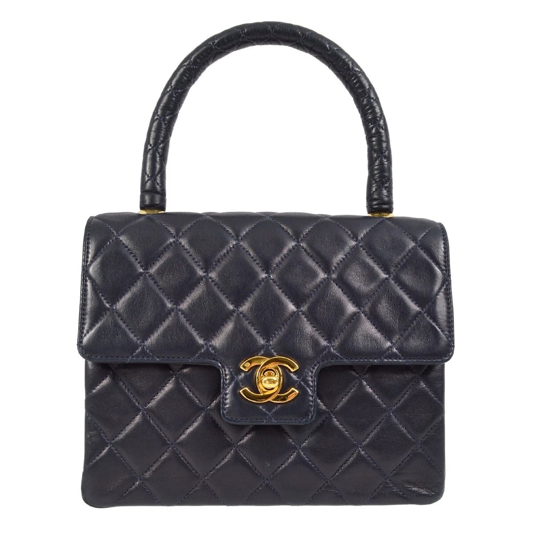 CHANEL NAVY LAMBSKIN TOP HANDLE HANDBAG: Chanel Navy Lambskin Top Handle Handbag Brand: CHANEL Type/Style: Top Handle Bag Material: Lambskin Leather Color: Navy Size: W 7.9 x H 5.9 x D 3.1 " Handle Drop. 3.9 " Accessories: None A