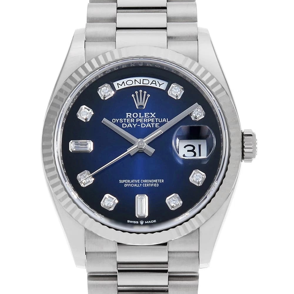 ROLEX DAY DATE 8P DIAMOND / 2P BAGUETTE DIAMOND WRIST WATCH: ROLEX Day date 8P diamond / 2P baguette diamond Wrist Watch Brand: ROLEX Type: Wrist watch Material: Band Material White Gold, Case Material White Gold Color: Blue Size: Case:W36mm Circumference o