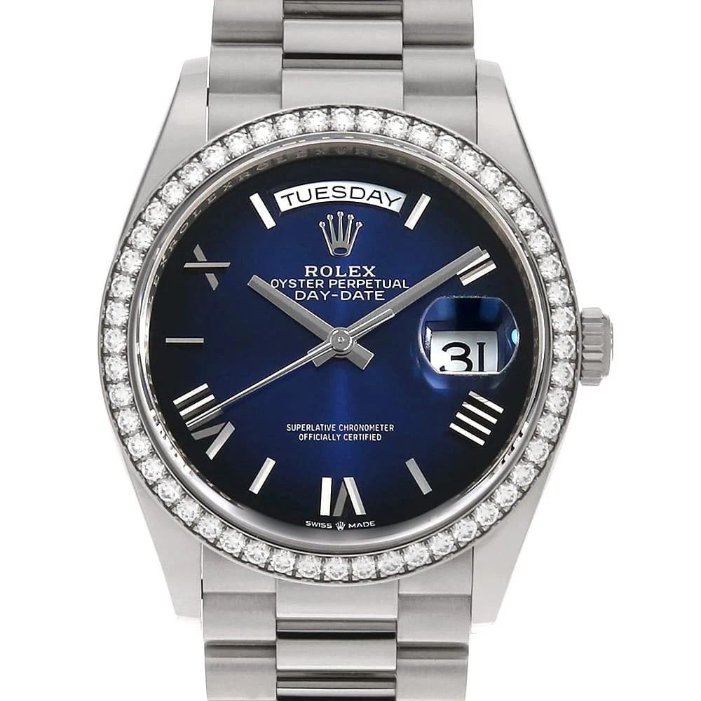 ROLEX DAY-DATE 36 WITH DIAMOND BEZEL BLUE OMBRE WRIST WATCH: ROLEX Day-Date 36 with diamond bezel blue Ombre Wrist Watch Brand: ROLEX Type: Wrist watch Material: Band Material White Gold, Case Material White Gold Color: Blue Size: Case:W36mm Circumference o