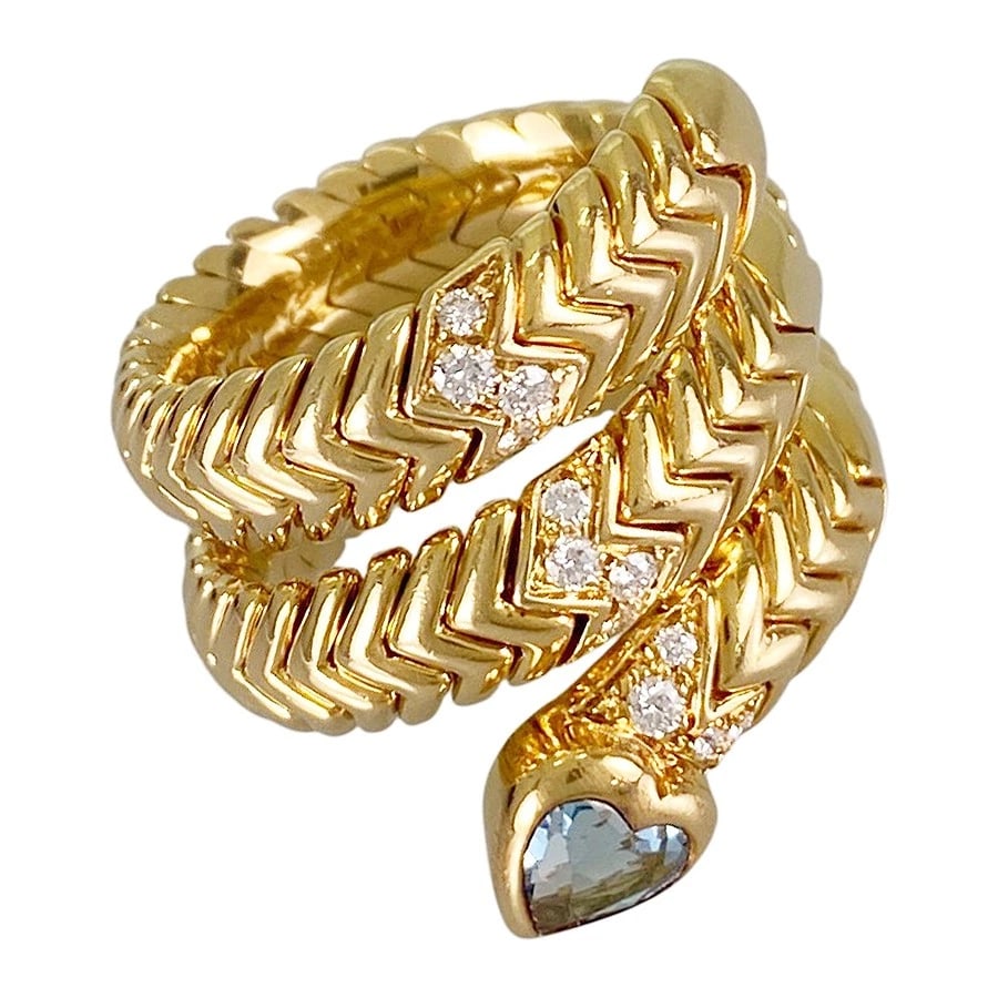 BVLGARI SERPENTI SPIGA YELLOW GOLD BLUE TOPAZ DIAMOND RING: BVLGARI Serpenti Spiga Yellow gold Blue Topaz Diamond Ring Brand: BVLGARI Type/Style: Ring Material: 18K Yellow Gold, Main Stone/Creation Topaz Color: Gold Size: US:6.5 Accessories: None