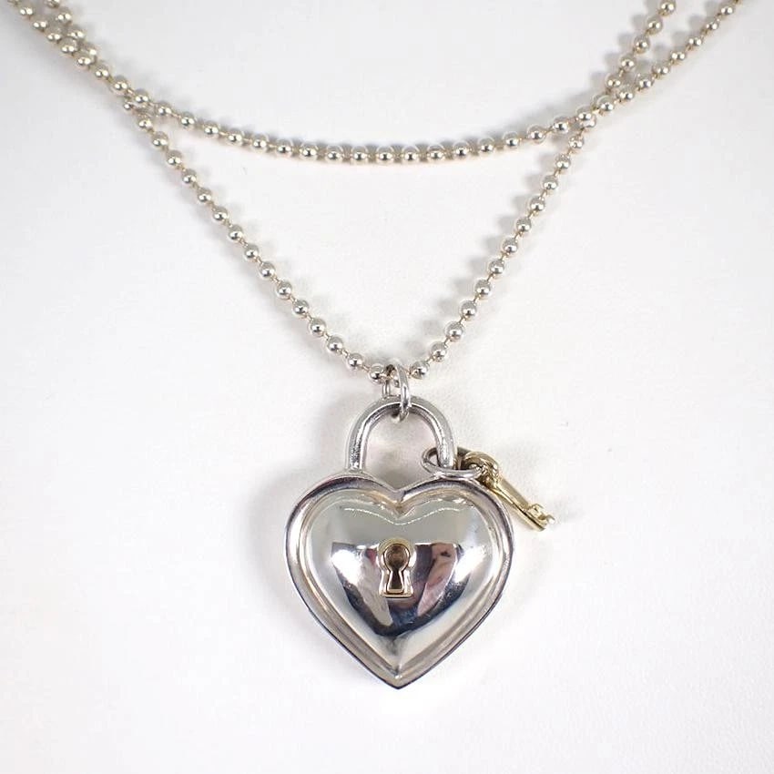 TIFFANY & CO. HEART LOCK SV925/750 NECKLACE: Tiffany & Co. Heart Lock SV925/750 Necklace Brand: Tiffany & Co. Type/Style: Necklace Material: Metal Purity 925/K18, Metal Silver/Gold, Main Stone/Creation Natural Color: Silver/Gold Size: