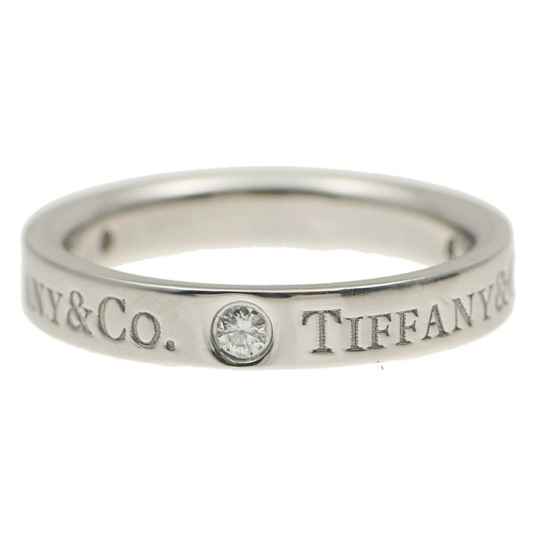TIFFANY & CO. FLAT BAND RING RING: Tiffany & Co. Flat Band Ring Ring Brand: Tiffany & Co. Type/Style: Ring Material: Metal Purity Pt950, Metal Platinum, Main Stone/Creation Natural Color: Platinum Size: US 4 Accessories: None <