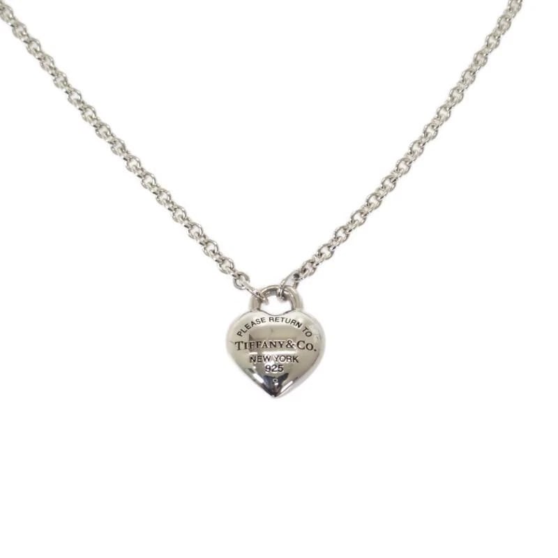 TIFFANY & CO. HEART 925 SILVER WOMEN'S NECKLACE: Tiffany & Co. Heart 925 Silver Women's Necklace Brand: Tiffany & Co. Type/Style: Necklace Material: Metal Purity 925, Metal Silver, Color: Silver Size: Width: approx. 11.9mm x Height: approx. 14.6