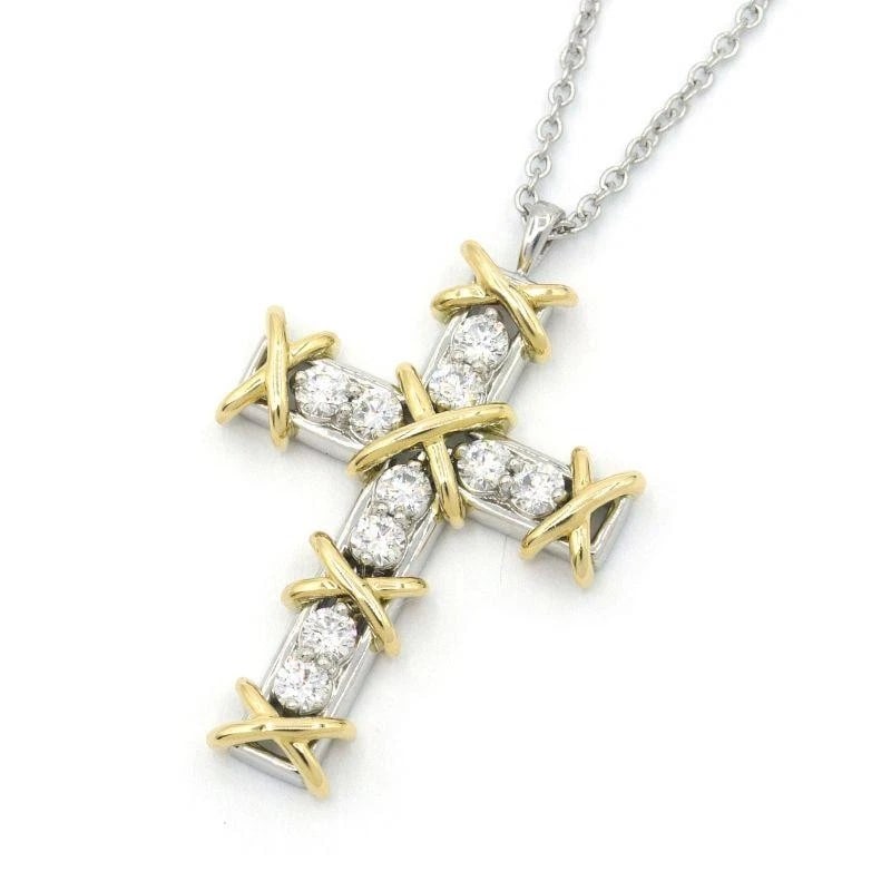 TIFFANY & CO. SCHLUMBERGER CROSS DIAMOND NECKLACE: Tiffany & Co. Schlumberger Cross Diamond Necklace Brand: Tiffany & Co. Type/Style: Necklace Material: Metal Purity Pt950/ K18, Metal Platinum / Yellow Gold, Main Stone/Creation Natural Color: Plati