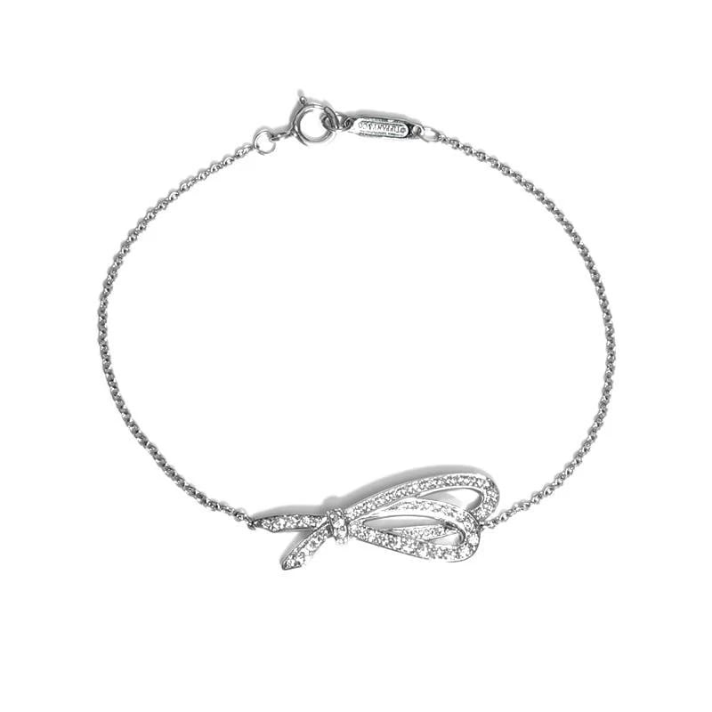 TIFFANY & CO. BOW RIBBON K18WG DIAMOND BRACELET: Tiffany & Co. Bow Ribbon K18WG Diamond Bracelet Brand: Tiffany & Co. Type/Style: Bracelet Material: Metal Purity K18, Metal White Gold, Main Stone/Creation Natural Color: White Gold Size: Bracelet
