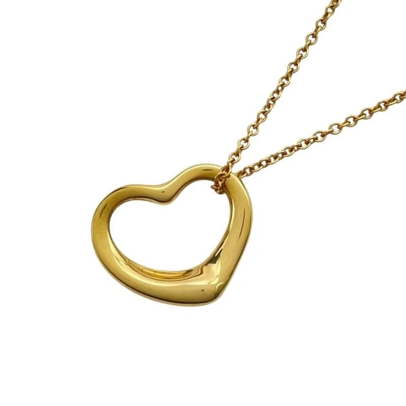 TIFFANY & CO. PERETTI OPEN HEART GOLD 750 NECKLACE: Tiffany & Co. Peretti Open Heart Gold 750 Necklace Brand: Tiffany & Co. Type/Style: Necklace Material: Metal Purity 750, Metal Gold, Main Stone/Creation Natural Color: Gold Size: Length: Approx. 1