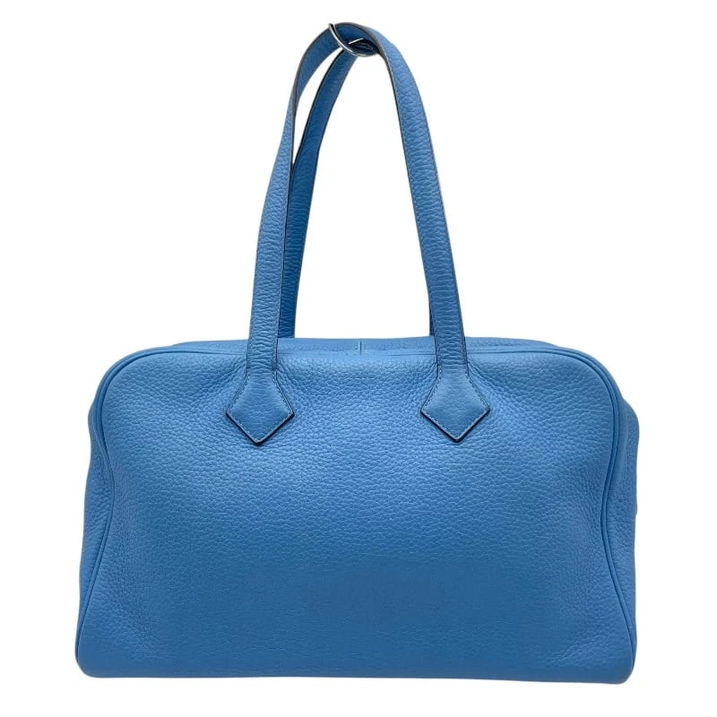 HERMES VICTORIA 35 ?R STAMP BLUE PARADISE CLEMENCE LEATHER TOTE: Hermes Victoria 35 ?R Stamp Blue Paradise Clemence Leather Tote Brand: HERMES Type: Handbag Material: Taurillon Color: Blue Paradise Size: W: 35cm / H: 22cm / D: 15.5cm Accessories: None
