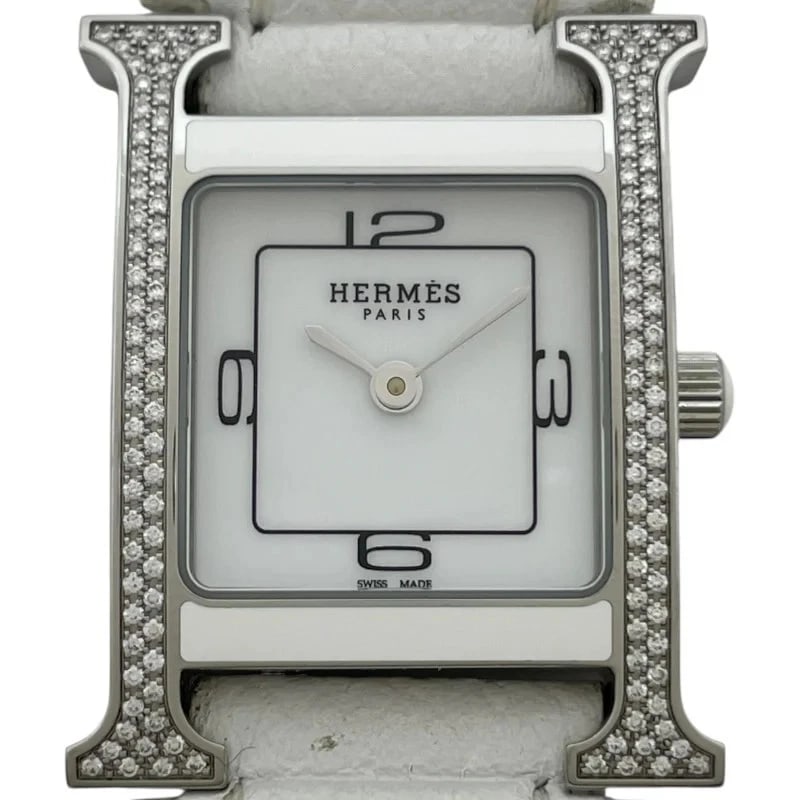 HERMÈS WATCH WHITE: Hermès Watch White Brand: HERMES Type: Wrist watch Material: SS Color: Dial Color White Size: [ Case size ] / Case shape: Square face / Case width: 21.2mm / Case height: 21.2mm / Case
