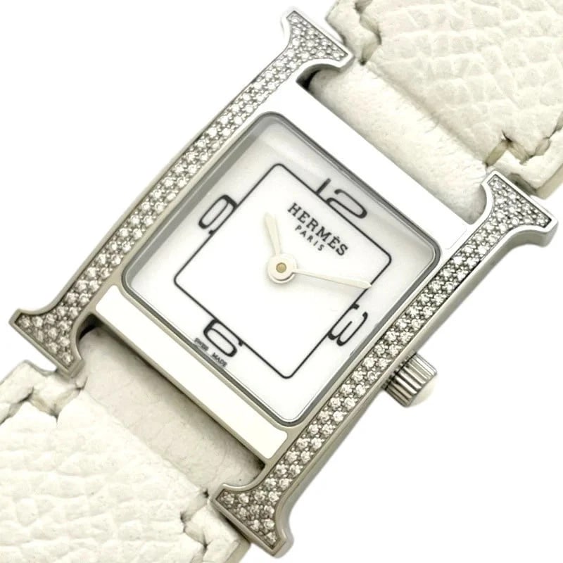 HERMÈS WATCH WHITE: Hermès Watch White Brand: HERMES Type: Wrist watch Material: SS Color: Dial Color White Size: [ Case size ] 21mm / Case shape: Square face / Case width: 21mm / Case height: 30mm / Case