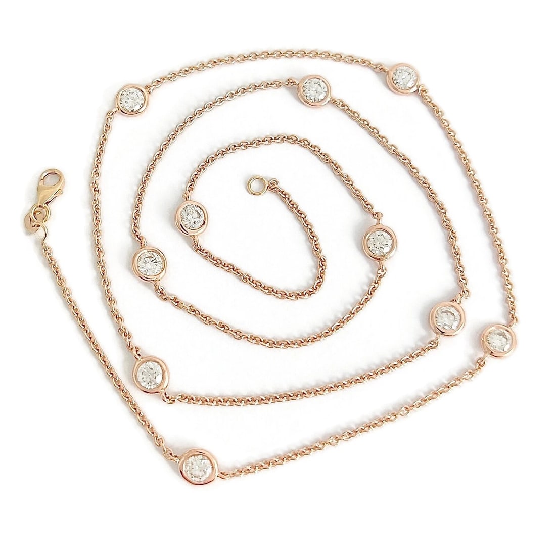 DIAMOND BEZEL STATION NECKLACE 14K PINK ROSE GOLD: Diamond Bezel Station Necklace 14K Pink Rose Gold Brand: Unbranded Type: Necklace Material: 14K rose gold, Main Stone/Creation Natural Color: Gold Size: Length: 22.25 inches Width: 5.5 mm 