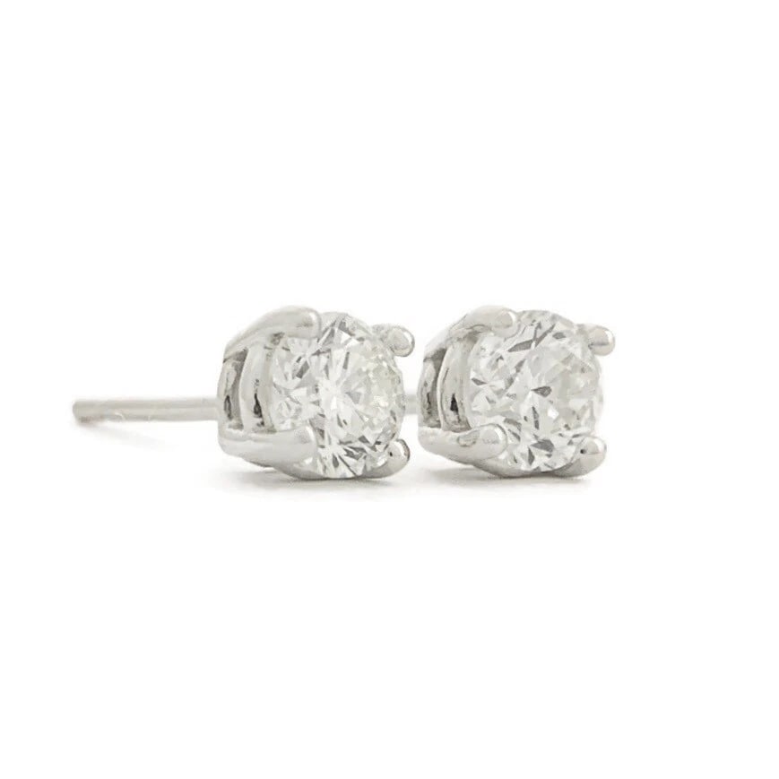 ROUND DIAMOND STUD EARRINGS 14K WHITE GOLD: Round Diamond Stud Earrings 14K White Gold Brand: Unbranded Type: Earrings Material: 14K white gold, Main Stone/Creation Natural Color: White Size: Measurements: 4.2 mm Accessories: None A