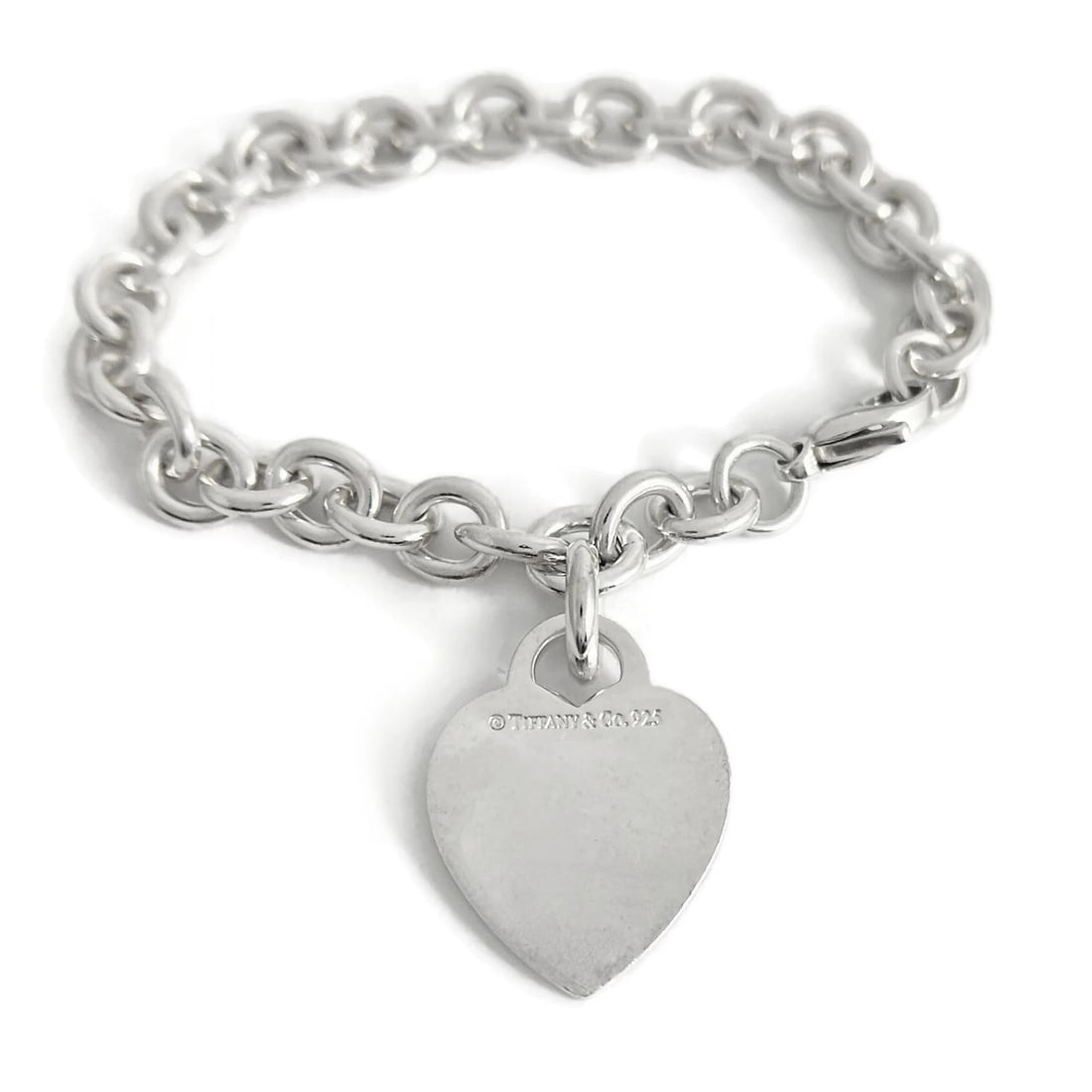 TIFFANY & CO. HEART CHARM BRACELET STERLING SILVE: Tiffany & Co. Heart Charm Bracelet Sterling Silve Brand: Tiffany & Co. Type: Bracelet Material: 925 sterling silver, Color: Silver Size: Length: 7.5 inches Width: 8 mm chain Charm: 1.1 inch x 20.7