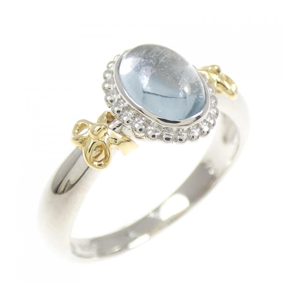 750YG/PT900 RIBBON BLUE TOPAZ RING: 750YG/PT900 Ribbon Blue Topaz Ring Brand: Unbranded Type: Blue Topaz ring Material: 750 Yellow Gold/Platinum 900, Main Stone/Creation Blue Topaz Color: yellow gold Size: US 5.5 Accessories: