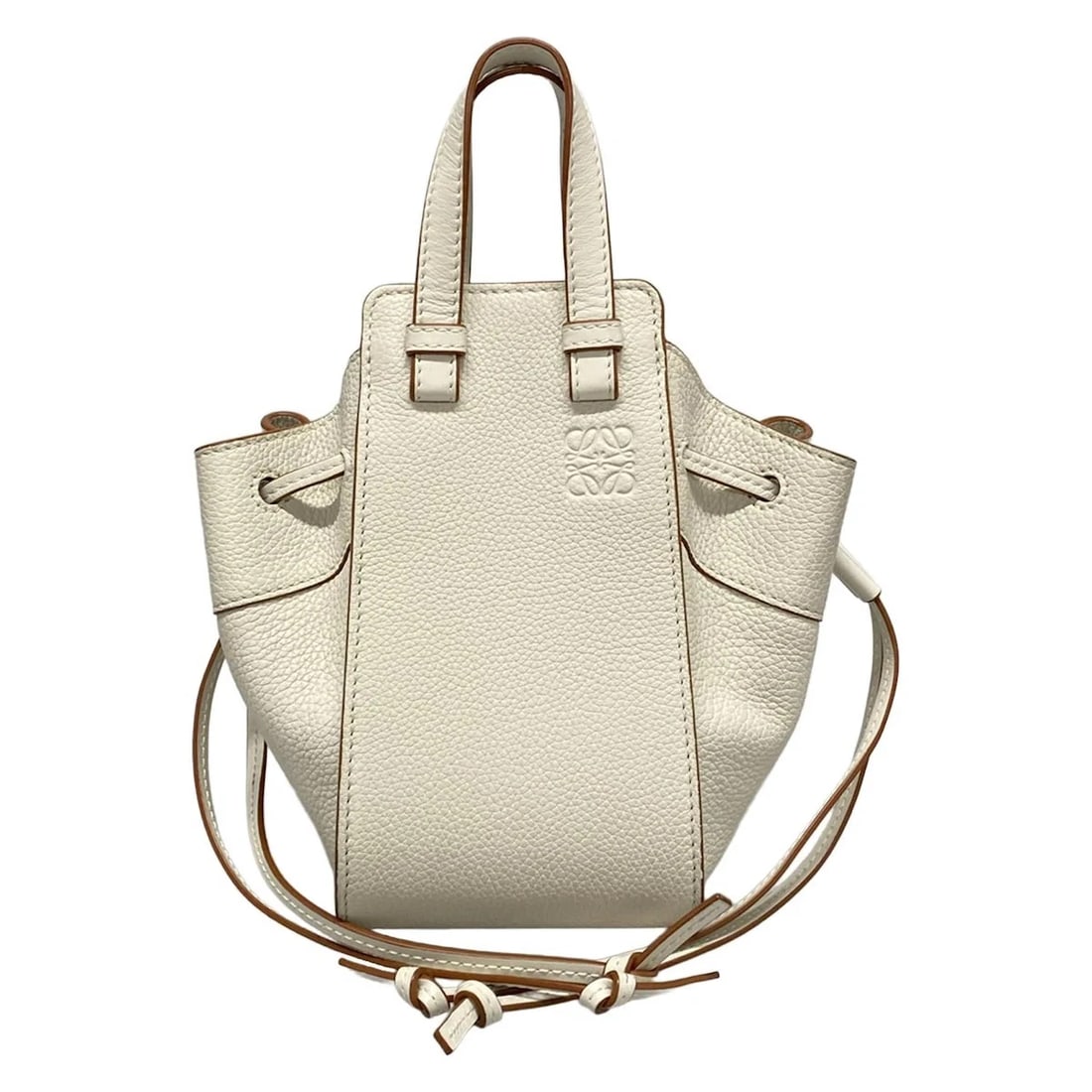 LOEWE HAMMOCK DRAWSTRING BAG MINI - CREAM LEATHER HANDBAG: LOEWE Hammock Drawstring Bag Mini - Cream Leather Handbag Brand: LOEWE Type: Handbag Material: Leather Color: Cream Size: Height : 7.48 inch (19 cm) Width : 4.13 inch (10.5 cm) - 7.87 inch (20 cm)