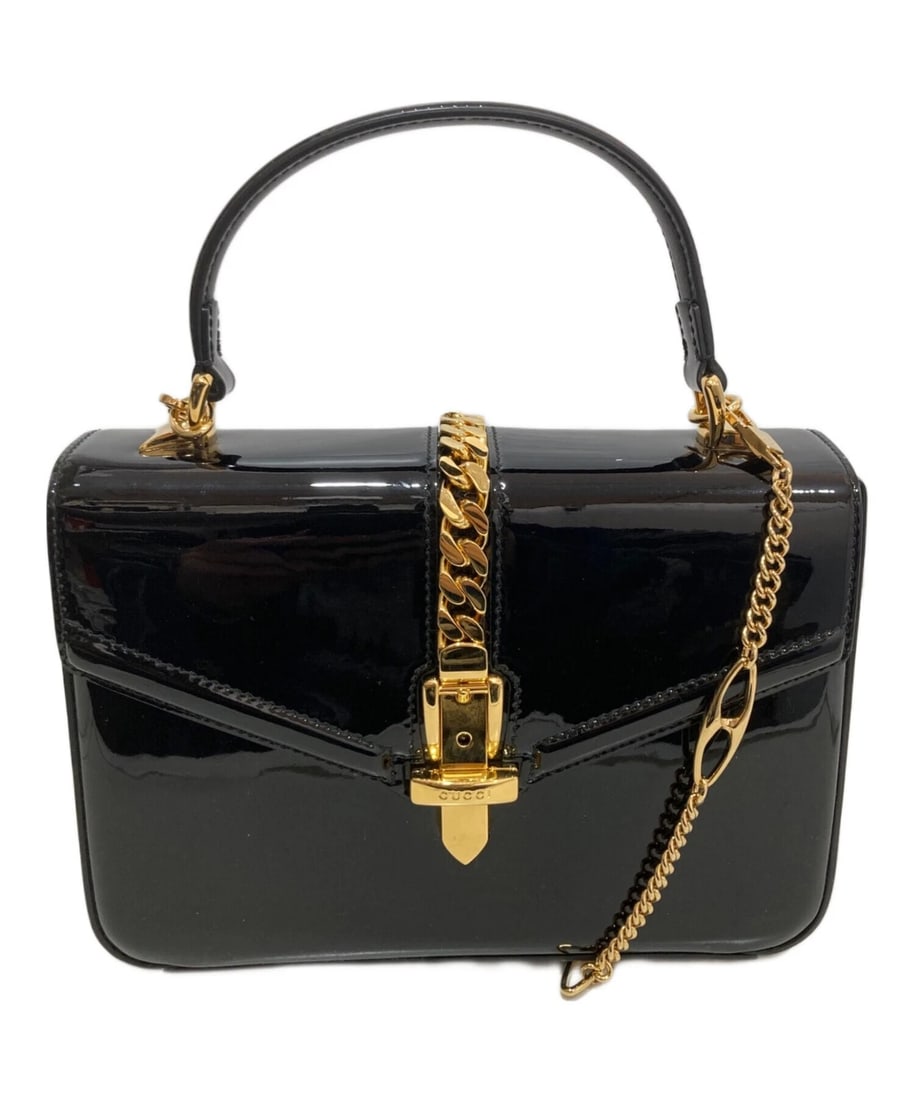 GUCCI SYLVIE 1969 TOP HANDLE PATENT LEATHER BAG: GUCCI Sylvie 1969 Top Handle Patent Leather Bag Brand: GUCCI Type: Handbag Material: none Color: Black Size: H:15cm / W:21.5cm / D:5.5cm [ Handle size ] 7cm Accessories: None Accessories N