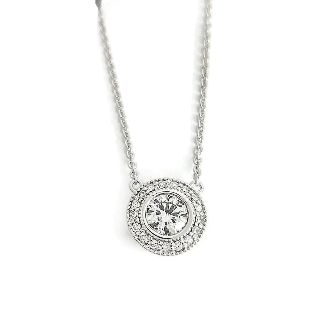 ROUND DIAMOND BEZEL HALO MILGRAIN PENDANT NECKLACE: Round Diamond Bezel Halo Milgrain Pendant Necklace Brand: Unbranded Type: Necklace Material: 14K white gold, Main Stone/Creation Natural Color: Silver Size: Length: 16 inches Pendant: 11.4 mm Acc
