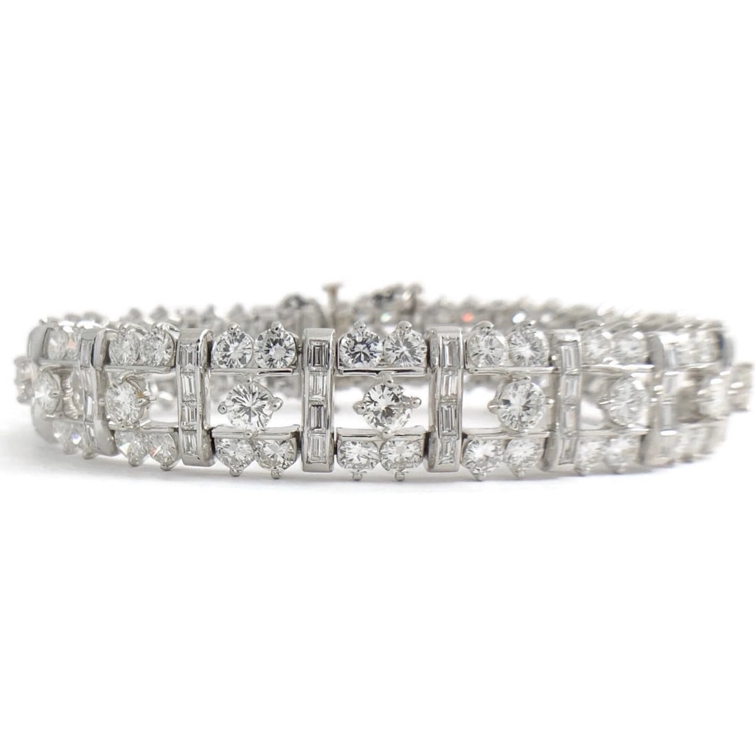VAN CLIEF ROUND BAGUETTE DIAMOND PLATINUM BRACELET: Van Clief Round Baguette Diamond Platinum Bracelet Brand: Estate Type: Bracelet Material: platinum, Main Stone/Creation Natural Color: Silver Size: Length: 7.5 inches Width: 13 mm Accessories: No