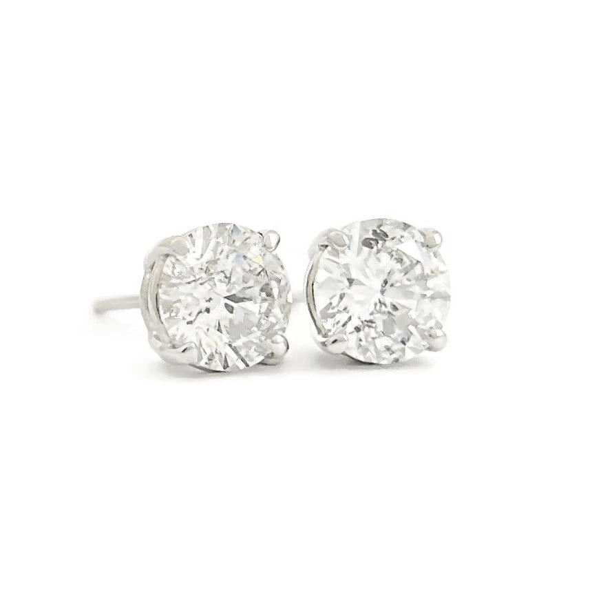 ROUND DIAMOND STUD EARRINGS 14K WHITE GOLD: Round Diamond Stud Earrings 14K White Gold Brand: Unbranded Type: Earrings Material: 14K white gold, Main Stone/Creation Natural Color: Silver Size: Measurements: 6.4 mm - 5.5 mm Accessories: Non