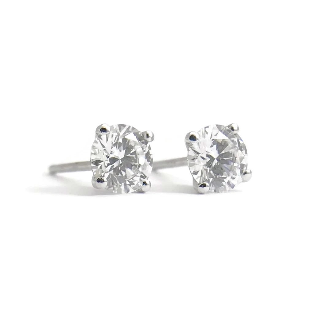 ROUND DIAMOND PLATINUM STUD EARRINGS: Round Diamond Platinum Stud Earrings Brand: Unbranded Type: Earrings Material: platinum, Main Stone/Creation Natural Color: White Size: Measurements: 4.7 mm Accessories: None Accessories N