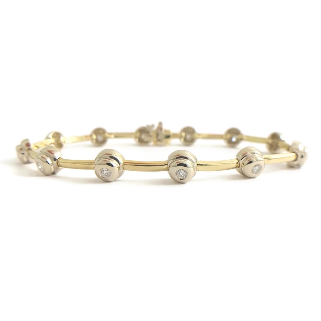 DIAMOND TWO-TONE BEZEL TENNIS BRACELET 14K YELLOW WHITE GOLD: Diamond Two-Tone Bezel Tennis Bracelet 14K Yellow White Gold Brand: Unbranded Type: Bracelet Material: 14K yellow and white gold, Main Stone/Creation Natural Color: Gold Size: Length: 7 inches Wid