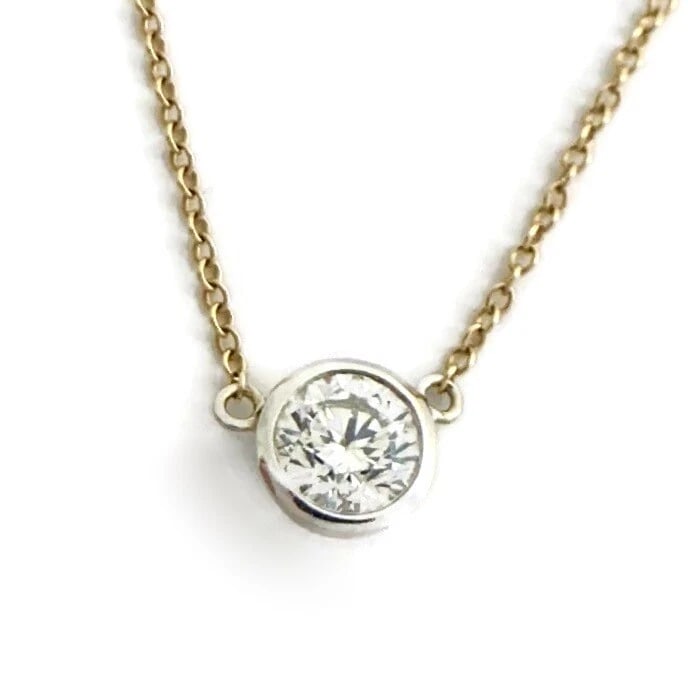 ROUND SOLITAIRE DIAMOND TWO-TONE BEZEL PENDANT NECKLACE: Round Solitaire Diamond Two-Tone Bezel Pendant Necklace Brand: Unbranded Type: Necklace Material: 14K yellow white gold, Main Stone/Creation Natural Color: Gold Size: Length: 16 inches Pendant: 6.