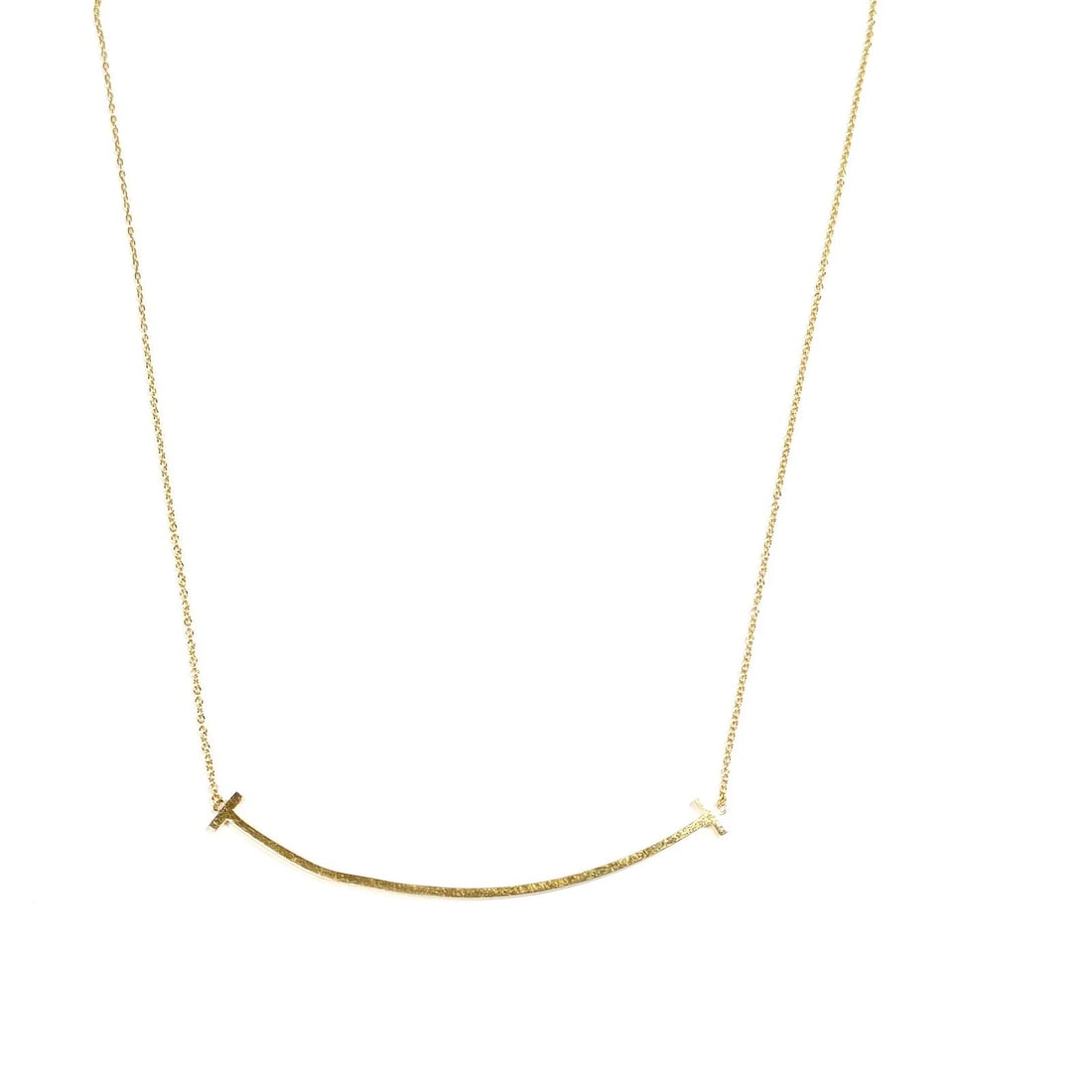 TIFFANY AND CO. NECKLACE T SMILE LARGE GOLD: Tiffany and Co. Necklace T smile Large Gold Brand: Tiffany and Co. Type: Necklace Material: Gold, Color: Yellow Gold Size: Pendant Size : 0.6X6.8 cm / 0.23X2.67 inch Chain Size : 39.5 cm / 15.5 in