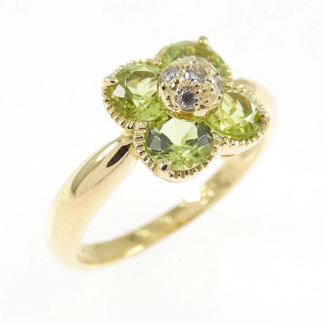 K18YG FLOWER PERIDOT RING: K18YG Flower Peridot Ring Brand: Unbranded Type: Peridot Ring Material: K18 yellow gold, Main Stone/Creation PeridotSecondary Stone Natural Color: Yellow Gold Size: US5 1/4 Accessories: None