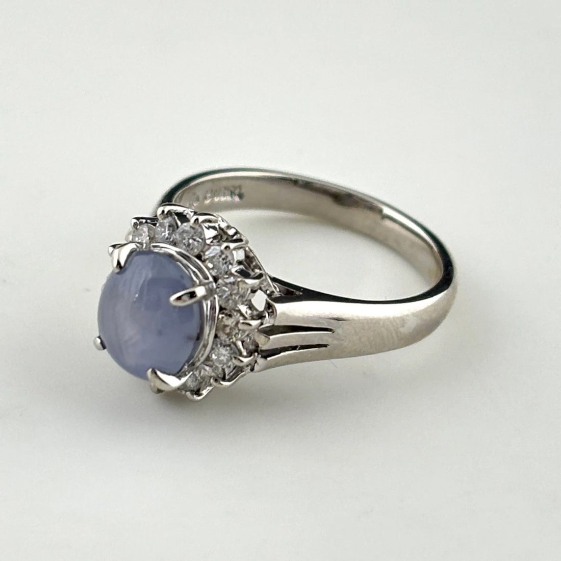 STAR SAPPHIRE DESIGN RING PLATINUM MELEE DIAMOND: Star Sapphire Design Ring Platinum Melee Diamond Brand: Unbranded Type: Ring Material: Pt850, Main Stone/Creation sapphire Color: Platinum Size: US6 Accessories: None Accessories Notice: W