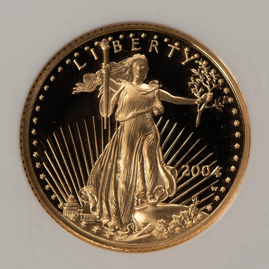 2004-W G$5 1/10 OZ GOLD AMERICAN EAGLE: 2004-W G$5 1/10 oz Gold American Eagle Brand/Mint: U.S. Mint Year: 2004 Fineness: 0.9167 Country of Origin: United States Accessories: None Accessories Notice: When purchasing pre-owned goods, ple