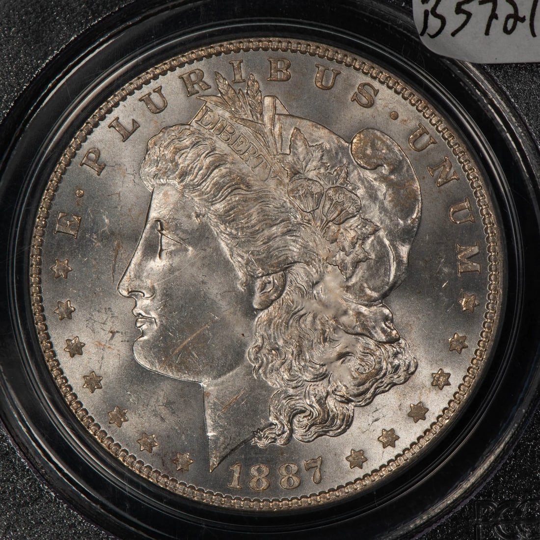 1887/6 $1 MORGAN SILVER DOLLAR: 1887/6 $1 Morgan Silver Dollar Brand/Mint: Philadelphia Year: 1887 Fineness: 0.9 Country of Origin: United States Accessories: None Accessories Notice: When purchasing pre-owned goods, please refe