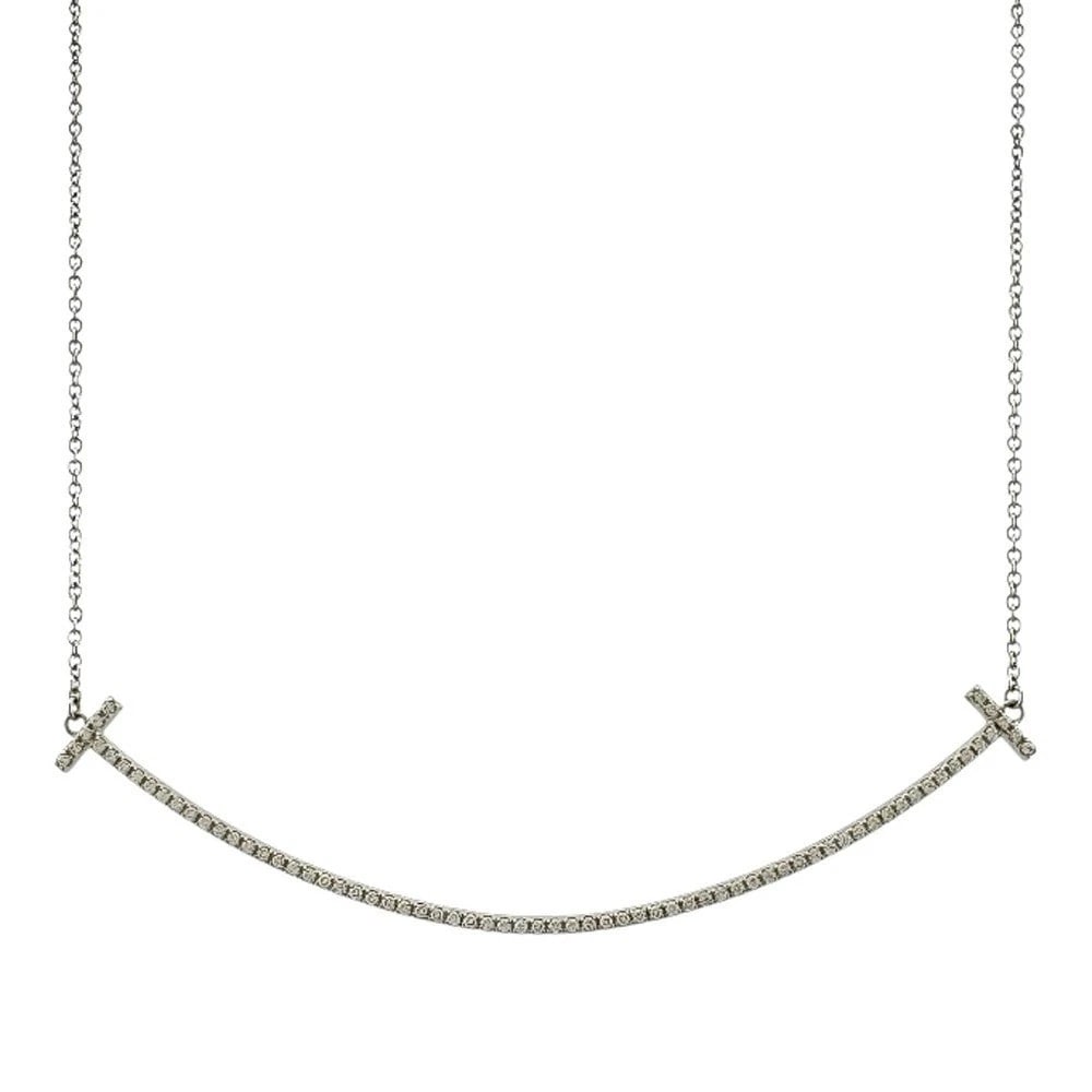 TIFFANY & CO. T SMILE DIAMOND NECKLACE 18K WHITE GOLD: Tiffany & Co. T Smile Diamond Necklace 18K White Gold Brand: Tiffany & Co. Type: Necklace Material: White Gold Main Stone/Creation Natural Color: Gold Size: Chain Length: Approx. 17.7 inches (45 cm, i