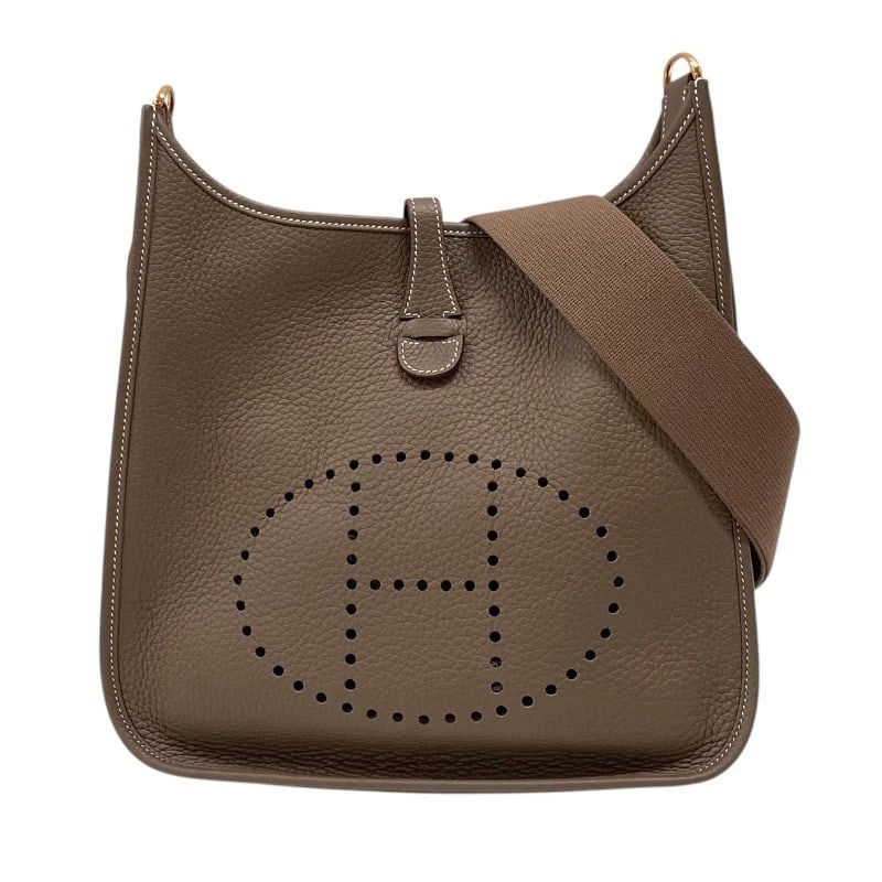 HERMES EVELYN 3 PM SHOULDER BAG: HERMES Evelyn 3 PM Shoulder Bag Brand: HERMES Type: Shoulder Bag Material: Taurillon Clemence Color: Etup Gold Hardware Size: W11.4 x H12.6x D2.8inch Accessories: None Accessories Notice: