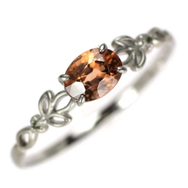 PT900 ORANGE ZIRCON COLOR STONE RING: Pt900 orange zircon color stone ring Brand: None Type: ring Material: Pt900 Main Stone/Creation Side Stonecolored stones Color: Silver Size: 8.25 - 8.5US Accessories: None Accessories Noti