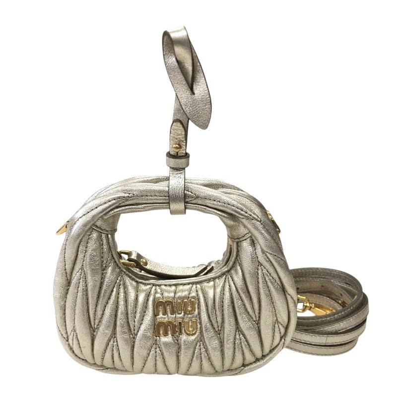 MIU MIU WONDER MATELASSE LEATHER MICRO HOBO BAG: miu miu Wonder Matelasse Leather Micro Hobo Bag Brand: miu miu Type: Handbag Material: Matelasse leather (sheepskin) Color: Gold Gold Hardware Size: W4.7 x H3.7x D1.6inch Accessories: None