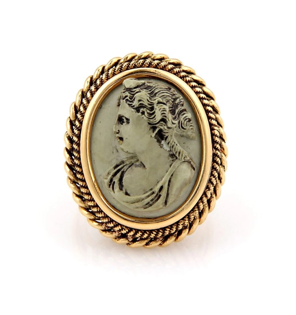 OVAL LAVA LADY CAMEO RING: Oval Lava Lady Cameo Ring Brand: Unbranded Type: Ring Material: 18k yellow gold and lava stone Color: None Size: 6 US Accessories: None Accessories Notice: When purchasing pre-owned goods,