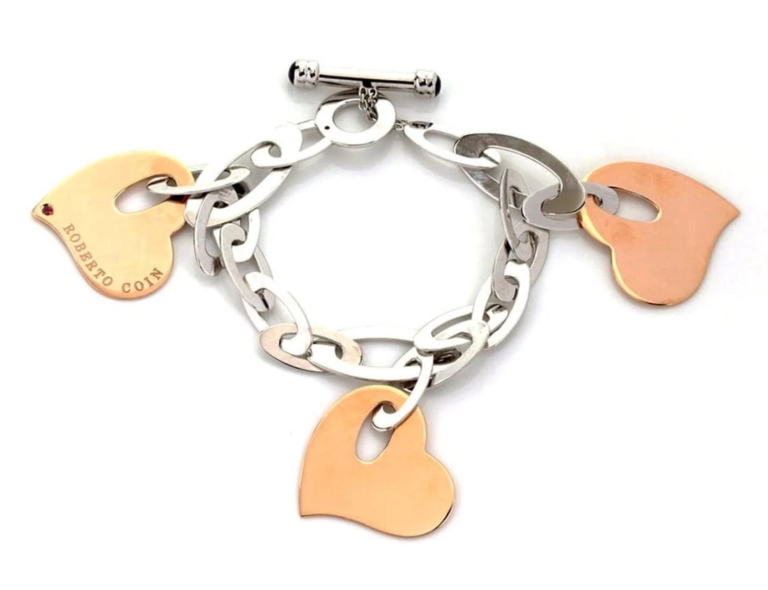ROBERTO COIN 18K ROSE & WHITE GOLD TRIPLE HEARTS BRACELET: Roberto Coin 18k Rose & White Gold Triple Hearts Bracelet Brand: Roberto Coin Type: Bracelet Material: 18k Rose & White Gold Color: Rose & White Gold Size: Measurement: 7.5" long x 11mm wide Heart