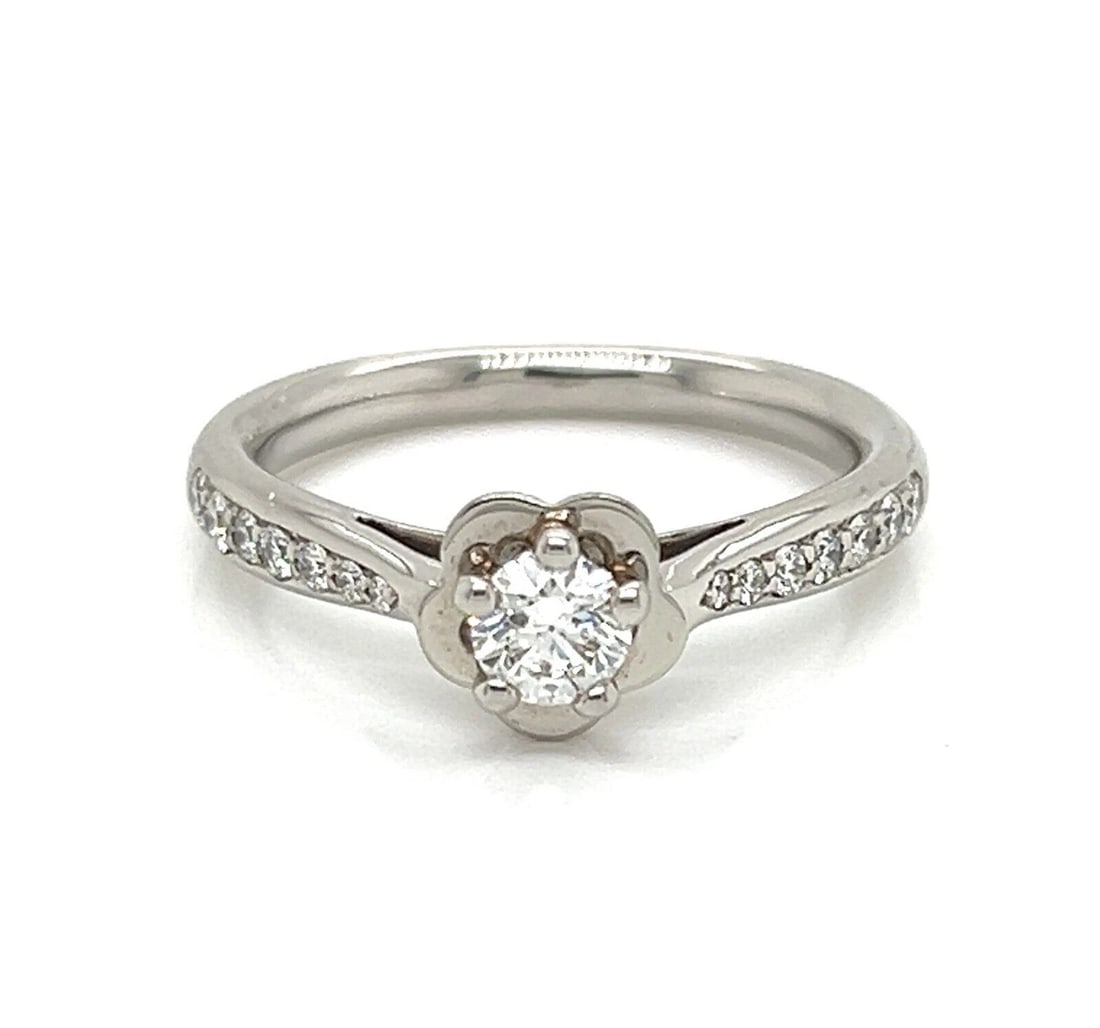 CHANEL CAMELLIA DIAMOND PLATINUM ENGAGEMENT RING: Chanel Camellia Diamond Platinum Engagement Ring Brand: CHANEL Type: Ring Material: PT950 Color: PT Size: 5.5 US Accessories: None Accessories Notice: When purchasing pre-owned goods, plea