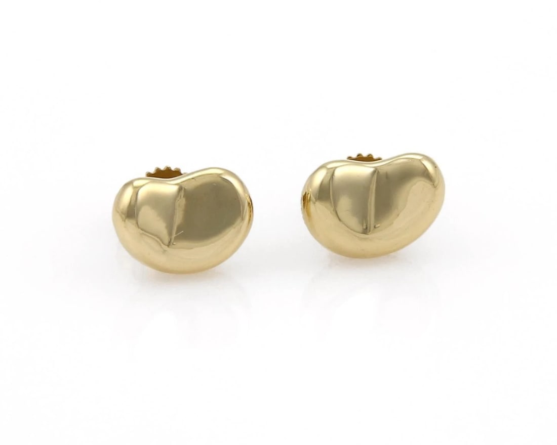 TIFFANY & CO. PERETTI BEAN STUD EARRINGS: Tiffany & Co. Peretti Bean Stud Earrings Brand: Tiffany & Co. Type: Earrings Material: 18k yellow gold Color: yellow Size: Measurements: 0.46" long x 0.32" wide Accessories: None Accessories