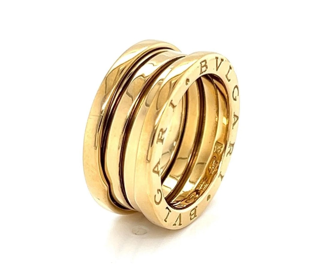 BVLGARI B.ZERO1 THREE BAND RING: Bvlgari B.Zero1 Three Band Ring Brand: Bvlgari Type: Ring Material: 18k yellow gold Color: Yellow Size: 6 US Accessories: None Accessories Notice: When purchasing pre-owned goods, please