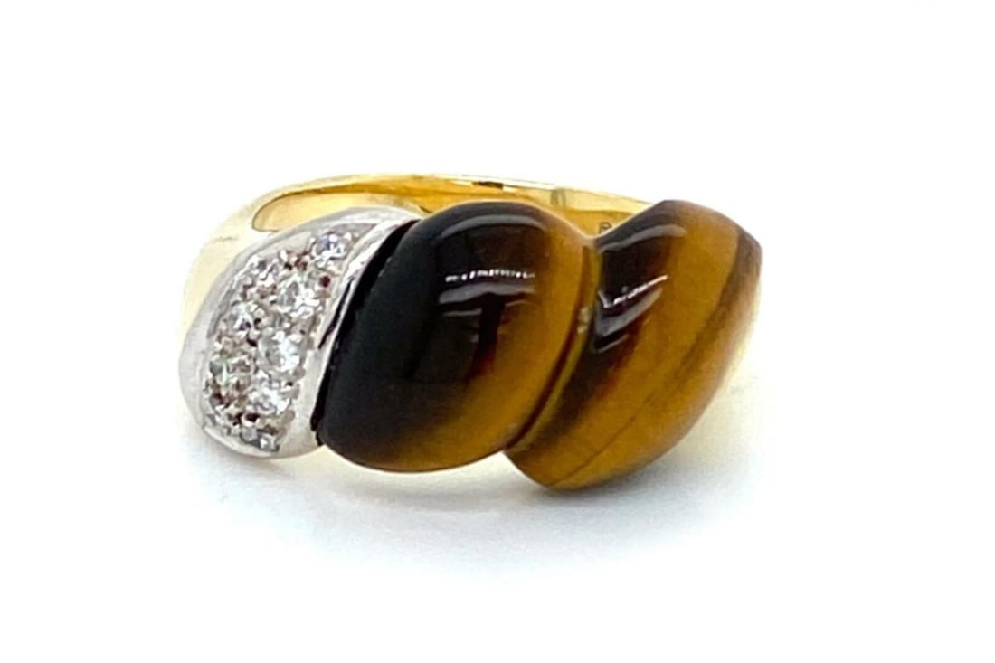 DIAMOND TIGER’S EYE FANCY BAND RING: Diamond Tiger’s Eye Fancy Band Ring Brand: Unbranded Type: Ring Material: 14k two-tone gold Main Stone/Creation Gemstone: tiger's eye Color: None Size: 6.5 US Accessories: None Accessories