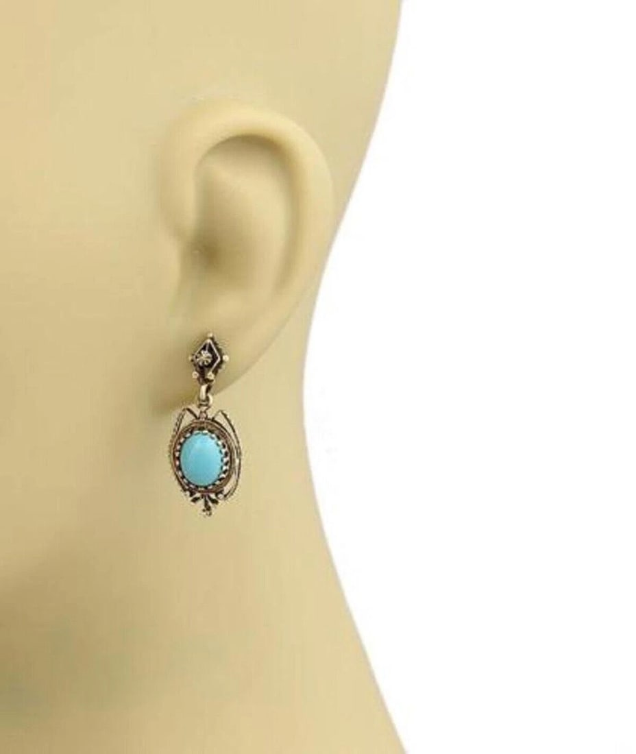 OVAL TURQUOISE 14K YELLOW GOLD DANGLE EARRINGS: Oval Turquoise 14k Yellow Gold Dangle Earrings Brand: Unbranded Type: Earrings Material: 14k Yellow Gold Main Stone/Creation Turquoise Color: None Size: Measurements: 32mm long x 13mm wide x