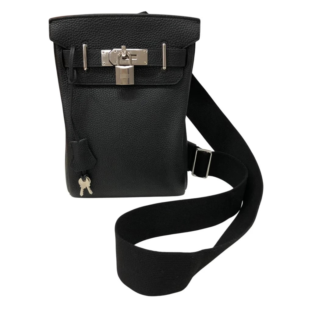 HERMES KELLY AKAD PM BODY BAG TOGO: HERMES Kelly Akad PM Body Bag Togo Brand: HERMES Type: Womwns Bag Material: Togo Color: Black with silver hardware Size: Width (approx.): 17cm Height (approx.): 26cm Depth (approx.): 8cm Accessor