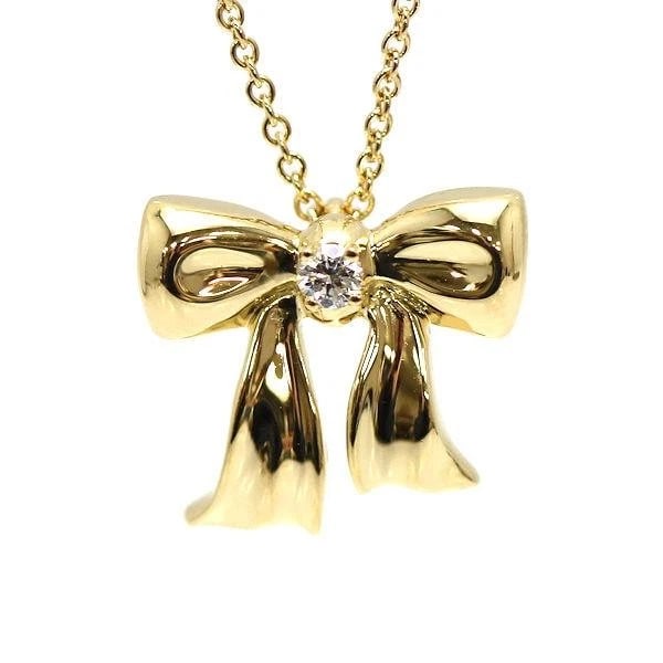 TIFFANY & CO. RIBBON K18NECKLACE: Tiffany & Co. Ribbon K18Necklace Brand: Tiffany & Co. Type: Necklace Material: K18Gold, Main Stone/Creation Natural Color: Gold Size: Total length: approx. 41 cmTop: approx. 1.5 cm wide x 1.3 cmlong <