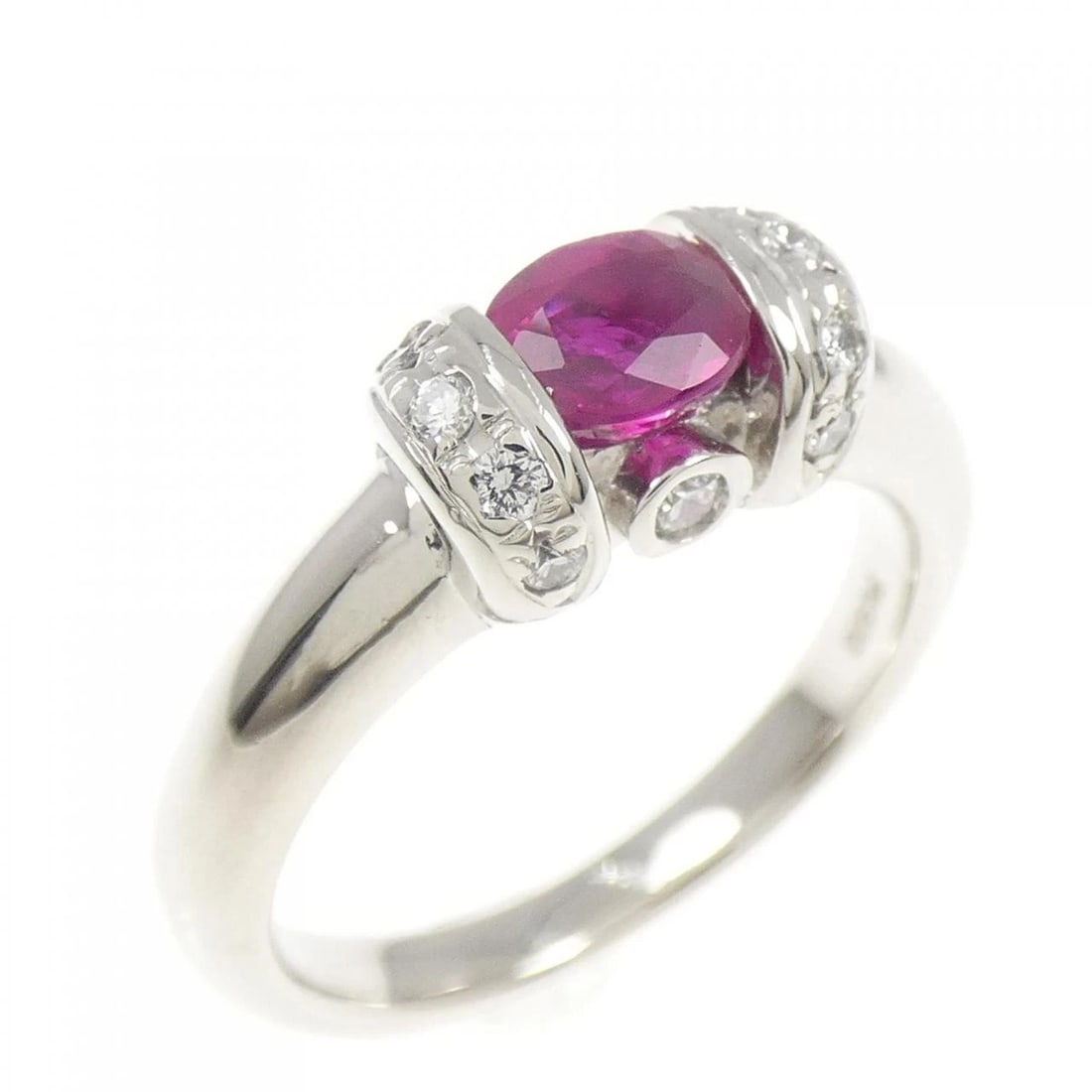 PT900 RUBY RING: PT900 Ruby Ring Brand: Unbranded Type: Ruby Ring Material: Platinum900, Main Stone/Creation Ruby Secondary Stone Diamond Color: Platinum Size: US 5 1/4 Accessories: None Accessories Notice: When