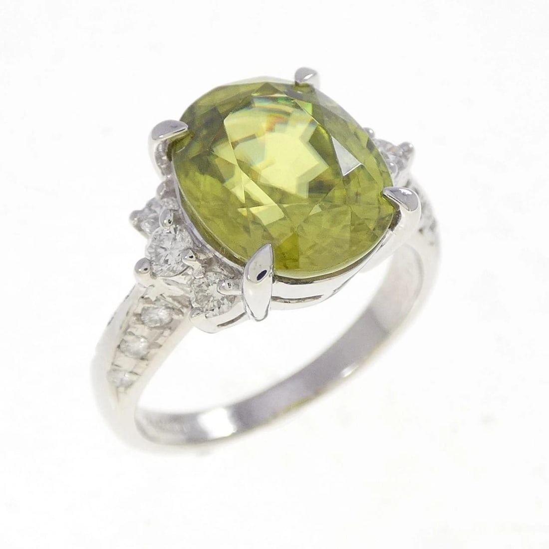 PT900 SPHENE RING: PT900 Sphene Ring Brand: Unbranded Type: Sphene Ring Material: Platinum900, Main Stone/Creation Sphene Secondary Stone Diamond Color: Platinum Size: US 5 3/4 Accessories: None Accessories Notice: