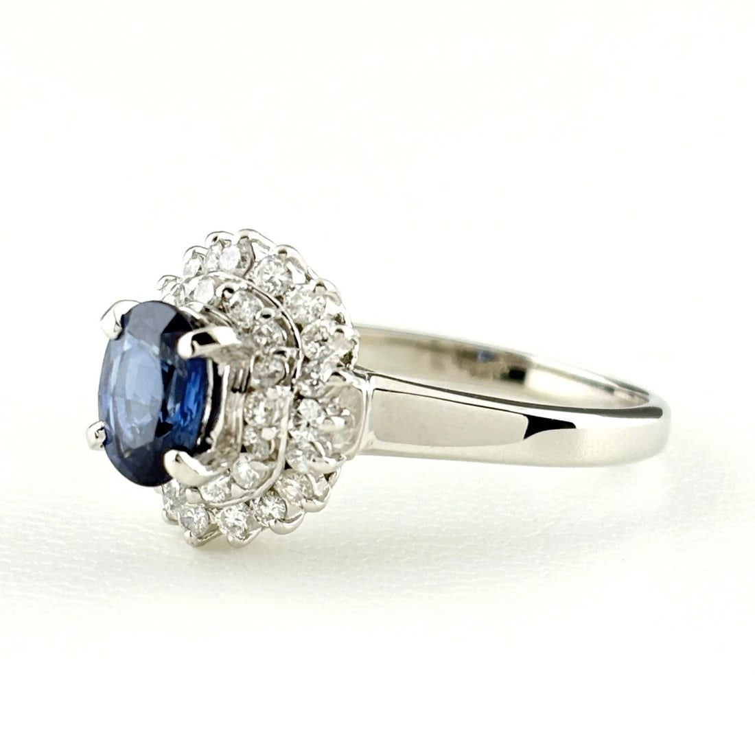SAPPHIRE DESIGN RING PLATINUM MELEE DIAMOND: Sapphire Design Ring Platinum Melee Diamond Brand: Unbranded Type: Ring Material: Pt900, Main Stone/Creation sapphire Color: Platinum Size: US 7.5 to 8 Accessories: None Accessories Notice: When