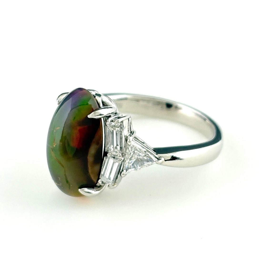 OPAL DESIGN RING PLATINUM MELEE DIAMOND: Opal Design Ring Platinum Melee Diamond Brand: Unbranded Type: Ring Material: Pt900, Main Stone/Creation opal Color: Platinum Size: US 7.5 to 8 Accessories: None Accessories Notice: When purchasing